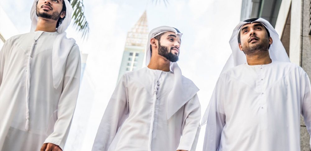 emirati men wearing traditional dress