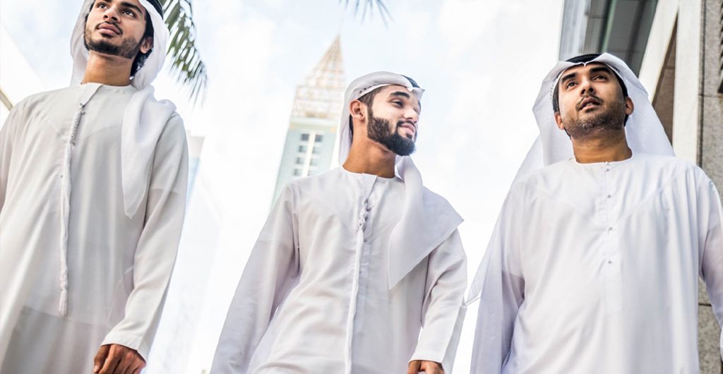 emirati men wearing traditional dress