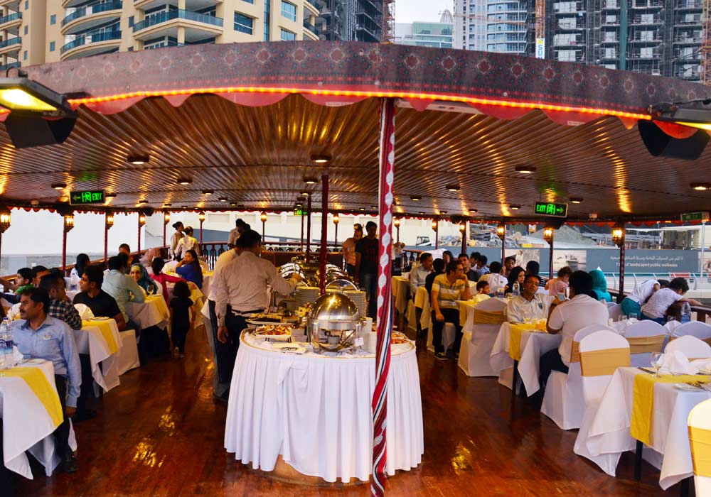 Feel special while sitting with your loved ones on traditional Arabic wooden dhow